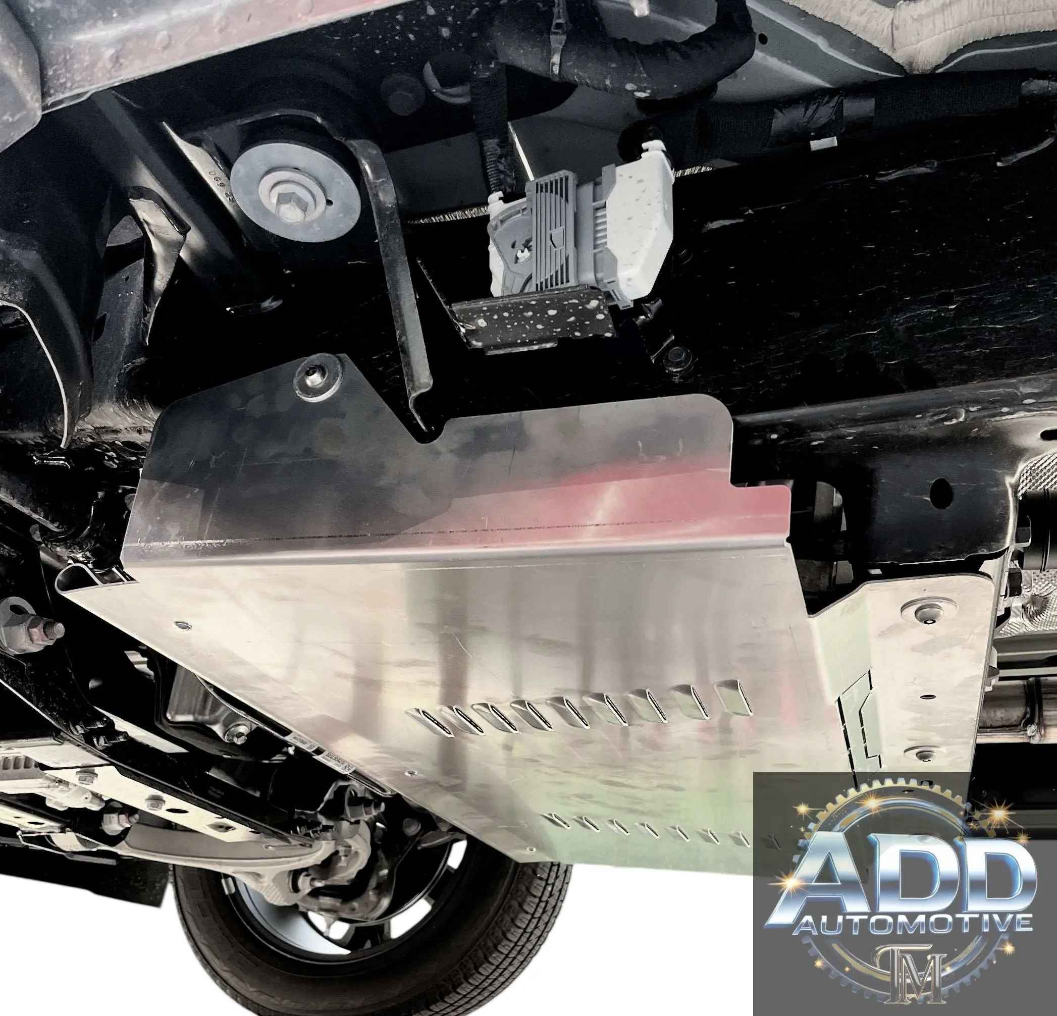 Ram 1500 Catalytic Converter Shield installed under truck protecting catalytic converter with aluminum shield and ventilation slots