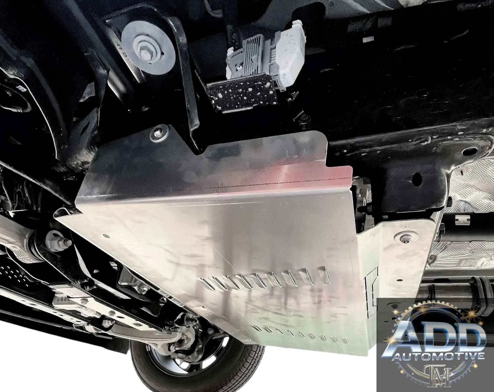 Ram 1500 catalytic converter shield installed under truck with marine-grade aluminum construction and ventilation slots