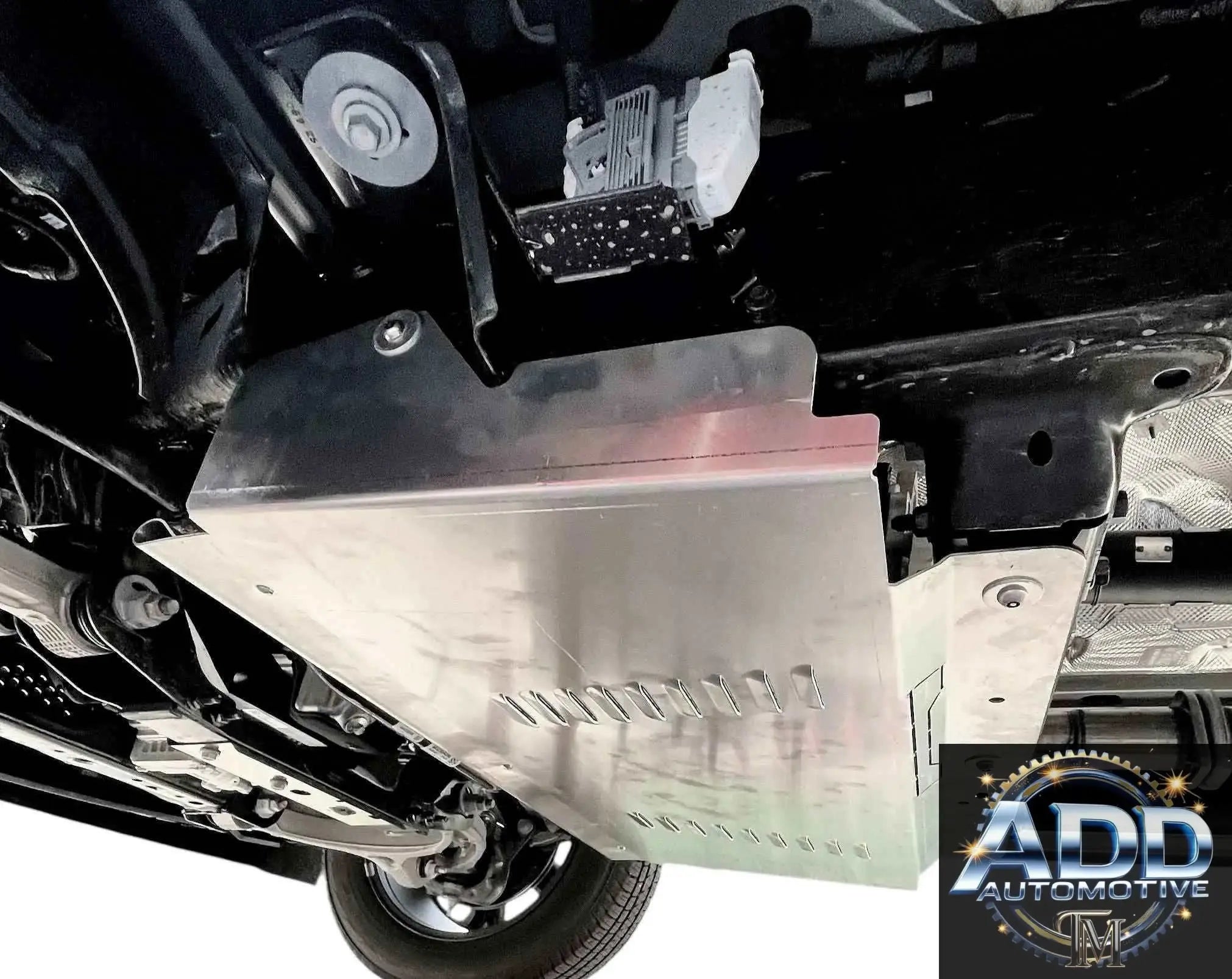 Ram 1500 catalytic converter shield installed under truck with marine-grade aluminum construction and ventilation slots