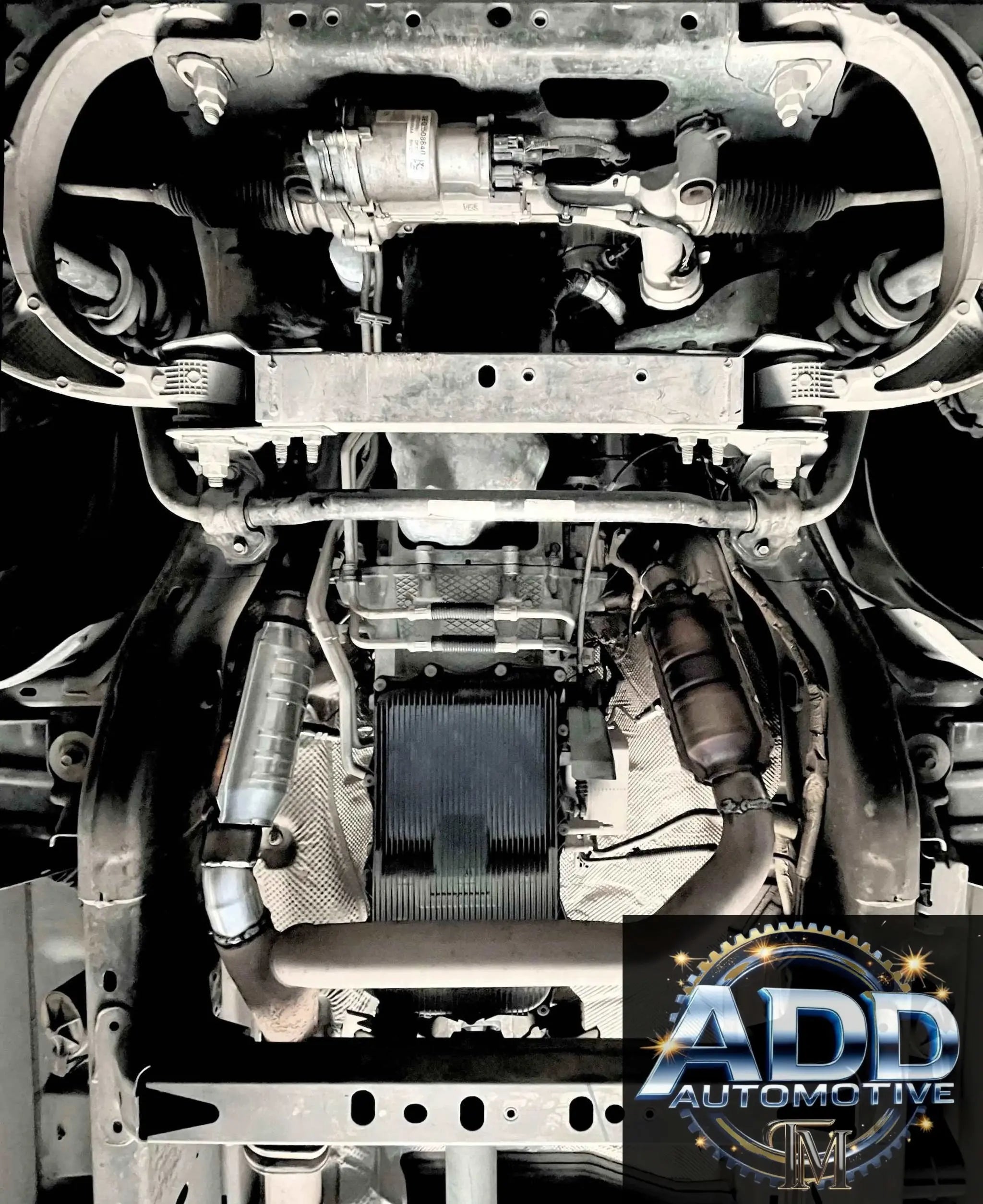 Ram 1500 catalytic converter shield installed under truck for theft protection