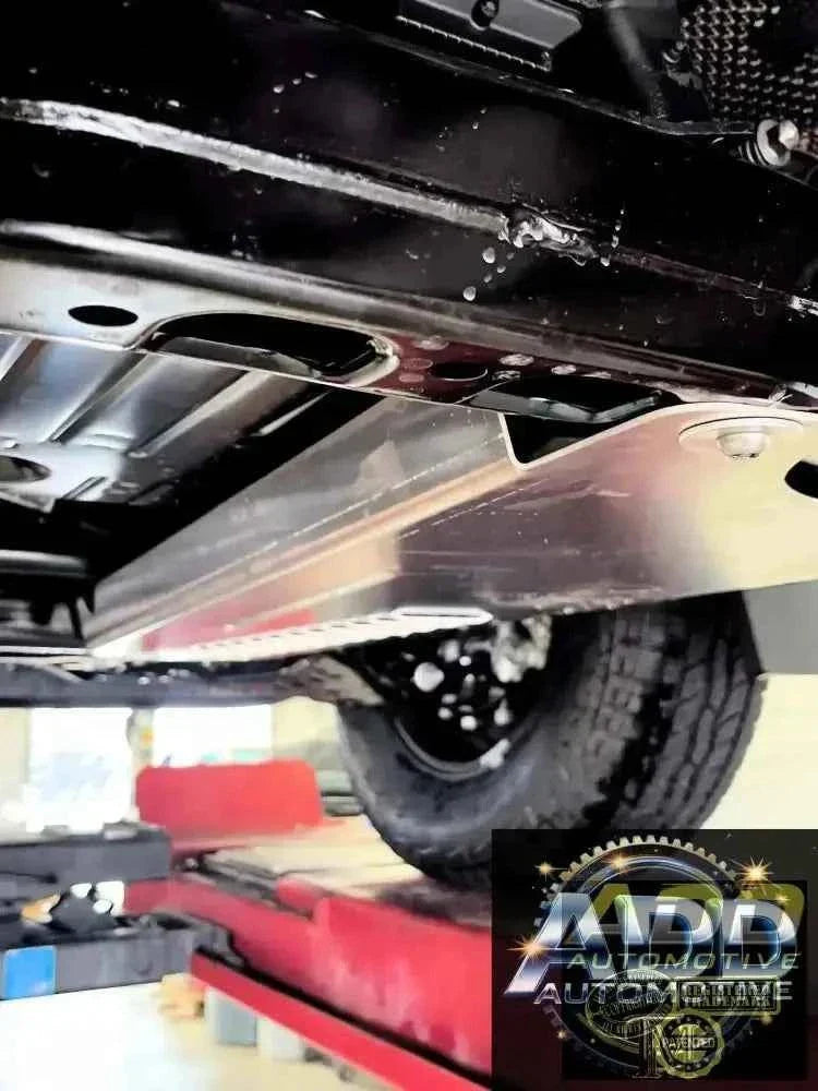 2024-2026 Toyota Tacoma catalytic converter shield in marine-grade aluminum with tamper-resistant bolts and ventilation louvers installed under truck