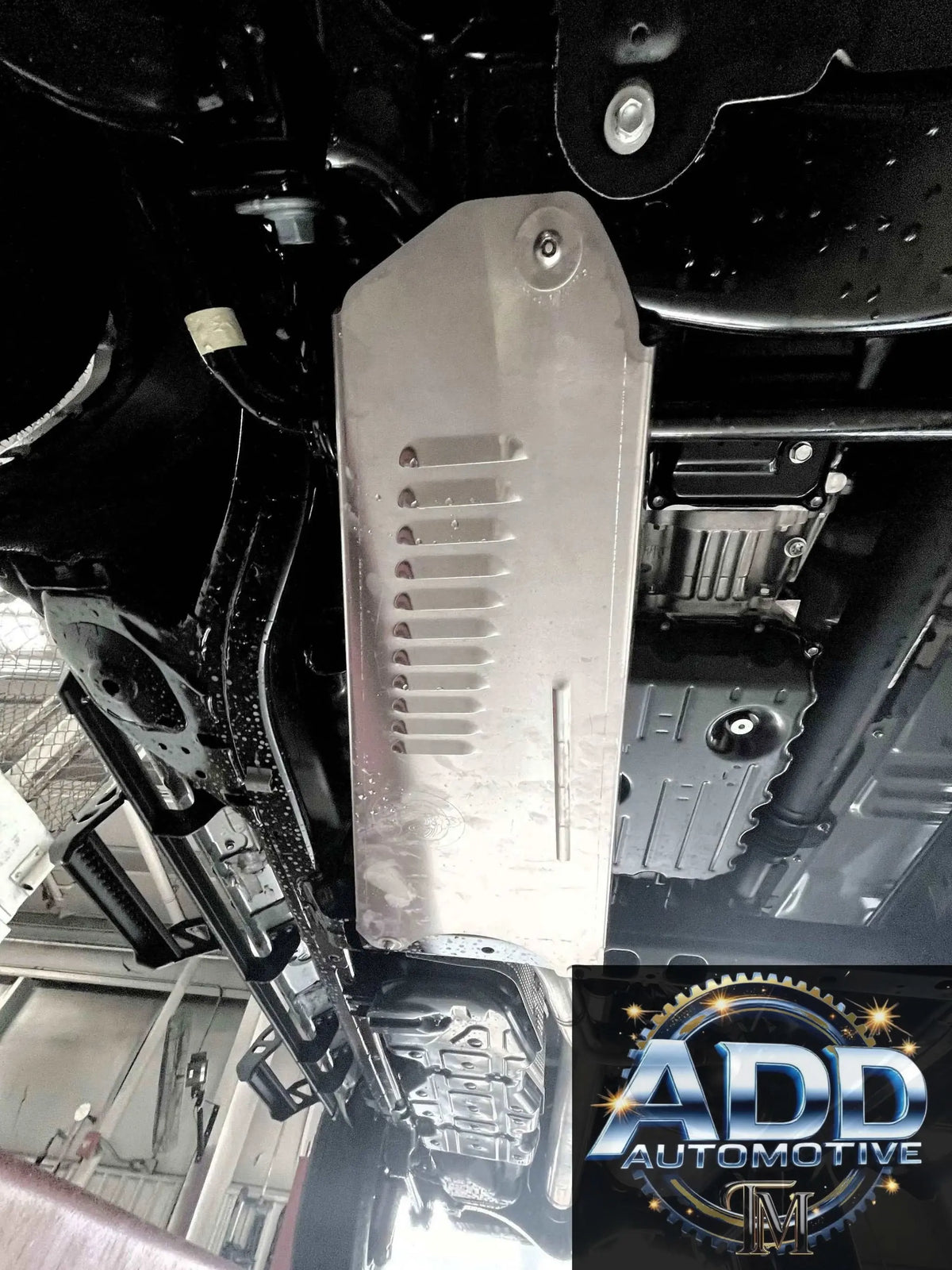 2024-2026 Toyota Tacoma Hybrid catalytic converter shield in marine grade aluminum with louvers and security bolts installed under truck