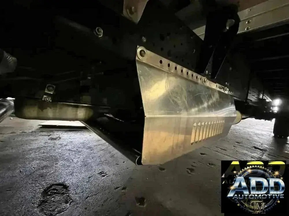 2015-2026 Isuzu 3500 & 4500 catalytic converter shield with marine-grade aluminum louvers and security bolts installed on truck underbody
