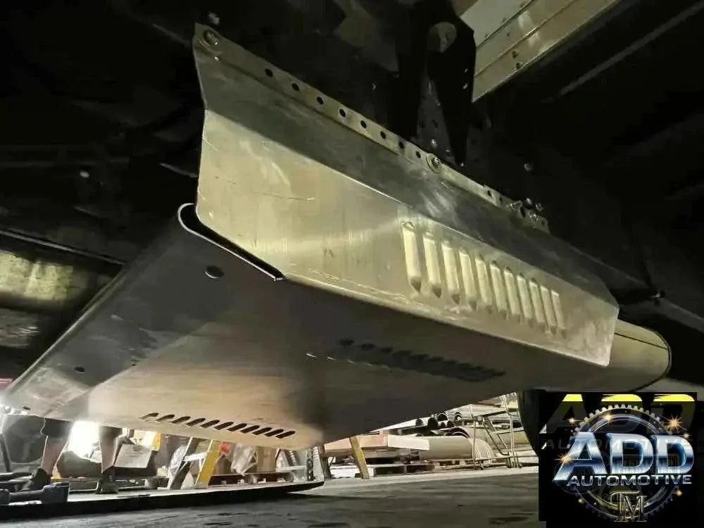 2015-2026 Isuzu 3500 & 4500 catalytic converter shield made of marine-grade aluminum with louvers and security bolts installed on truck underbody