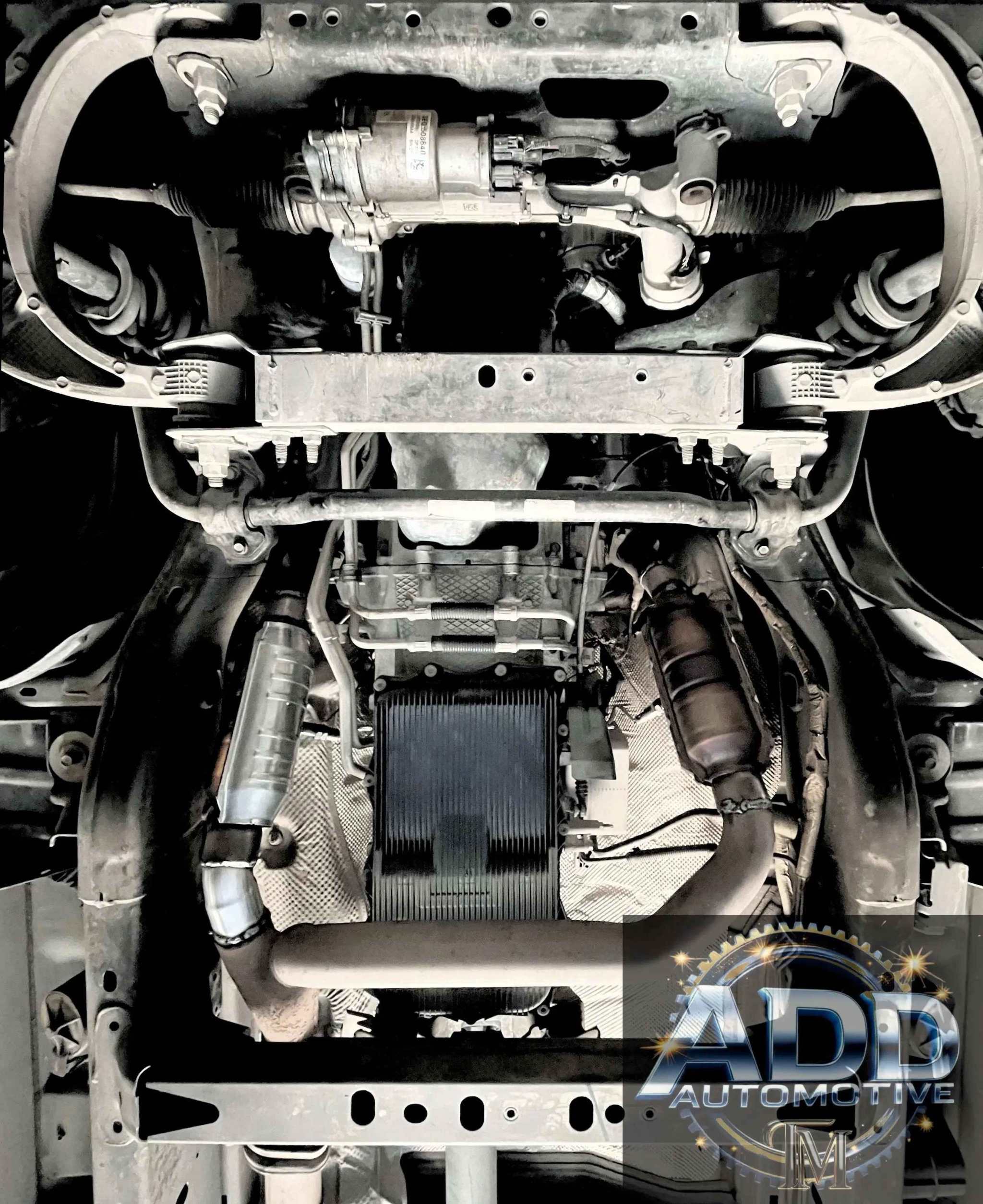 Ram 1500 catalytic converter shield installed under truck for theft protection