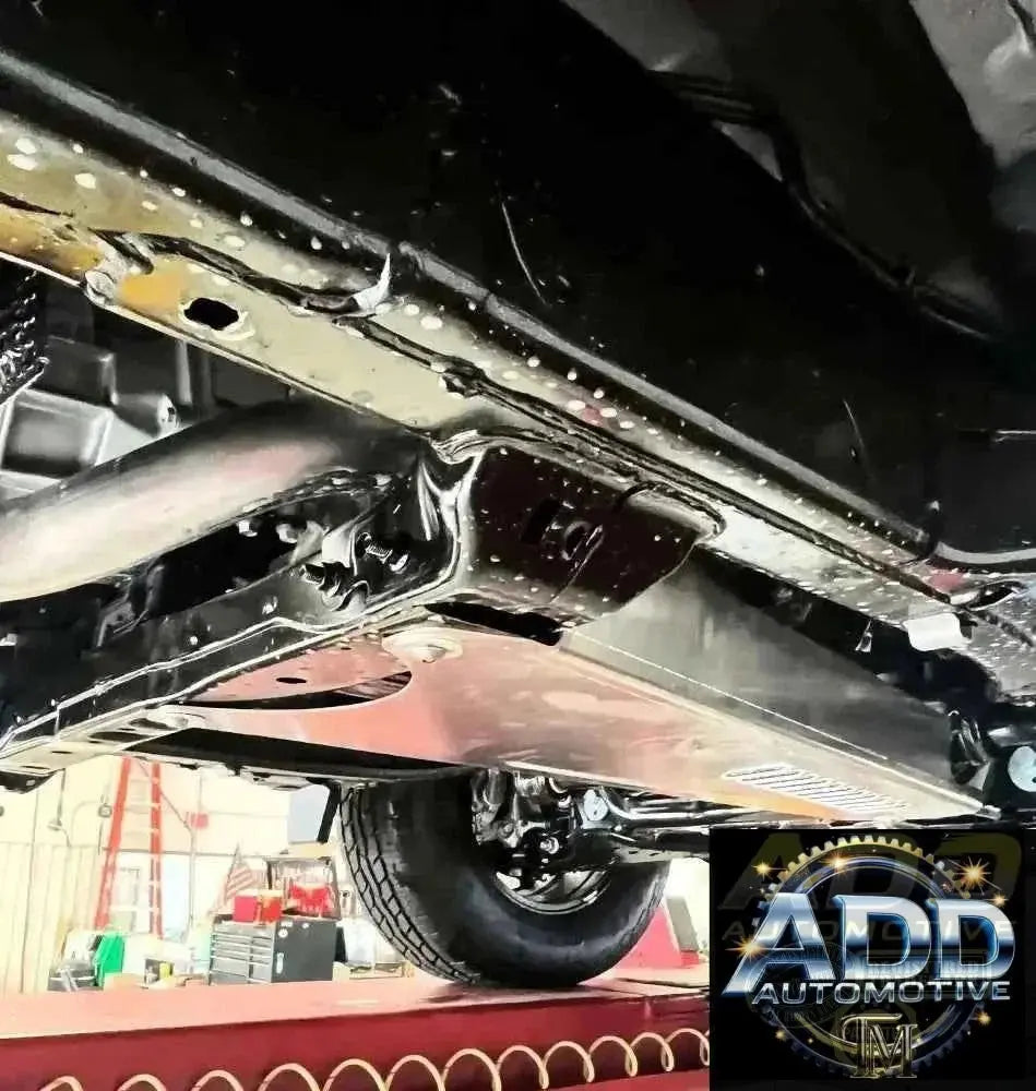 2024-2026 Toyota Tacoma catalytic converter shield made of marine-grade aluminum with louvered ventilation and tamper-resistant bolts installed under truck without drilling