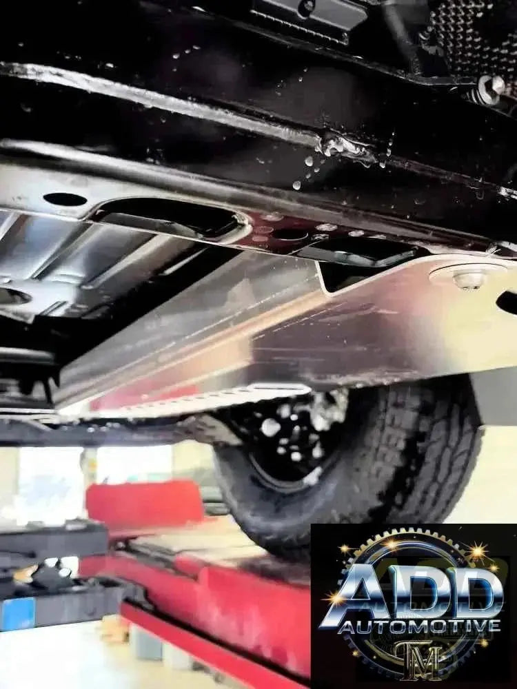 2024-2026 Toyota Tacoma catalytic converter shield in marine-grade aluminum with tamper-resistant bolts and ventilation louvers installed under truck